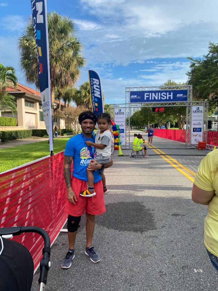 Mark Garel runs a 10k marathon, photo used in context of smrtPhone services