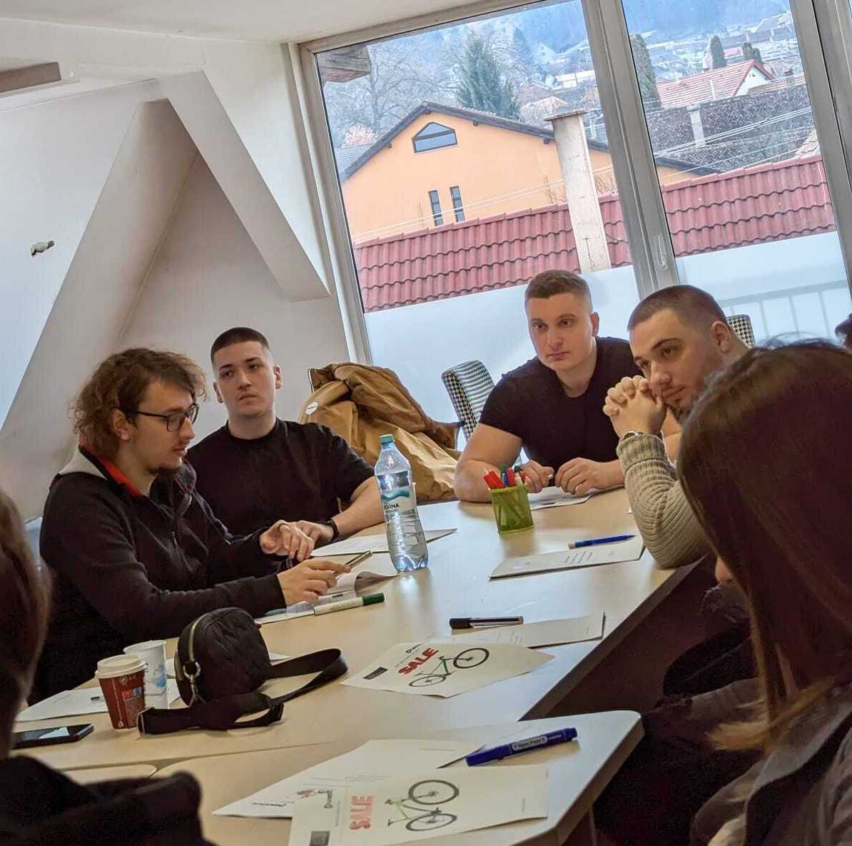 Andrei David sits with the smrtPhone support team in training