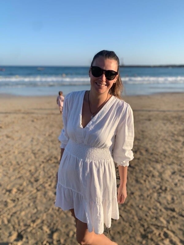 Ioana Parge on the beach in a white dress
