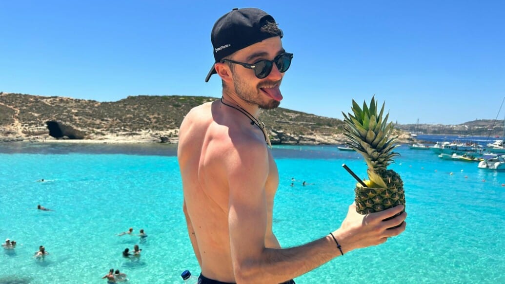 Vladi from CSA holds a pineapple drink