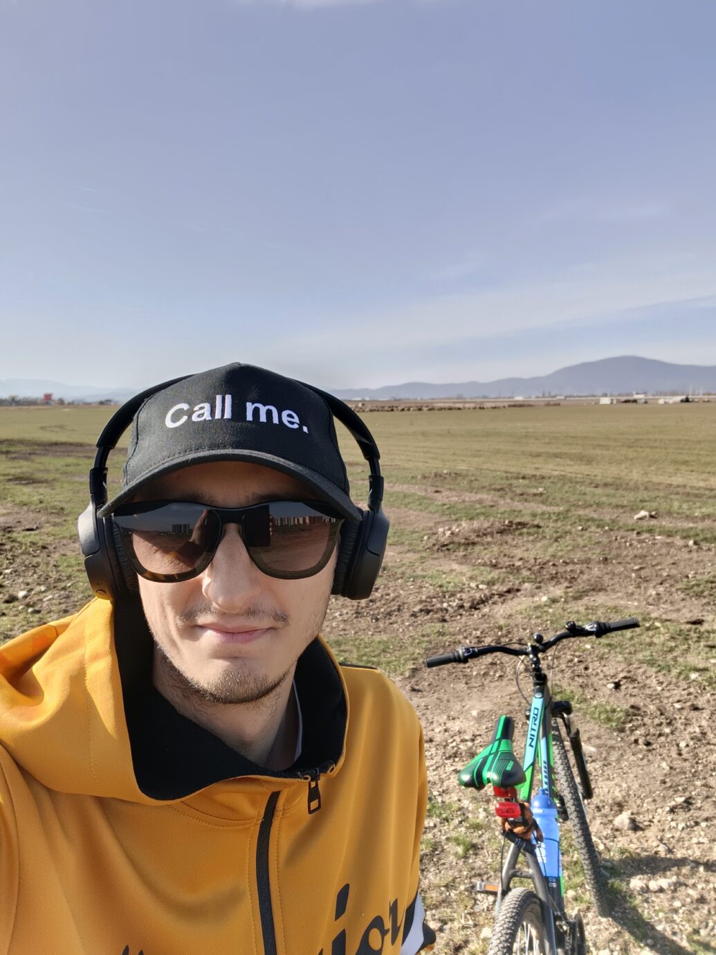Cezar Vilea with a smrtPhone hat on that says Call Me