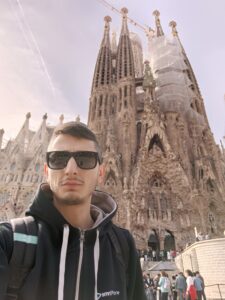 Cezar Vilea standing in front of a church