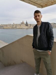 Cezar Vilea standing in front of a large body of water