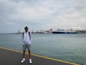 Cezar Vilea standing in front of boats