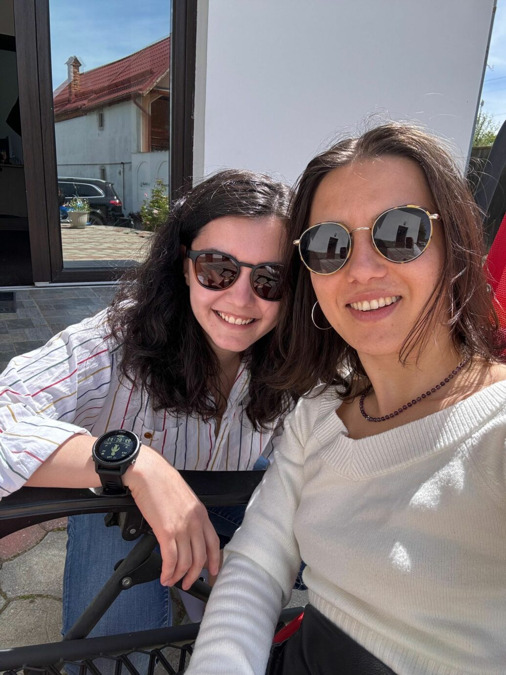 Andreea Cepoiu sitting with female friend